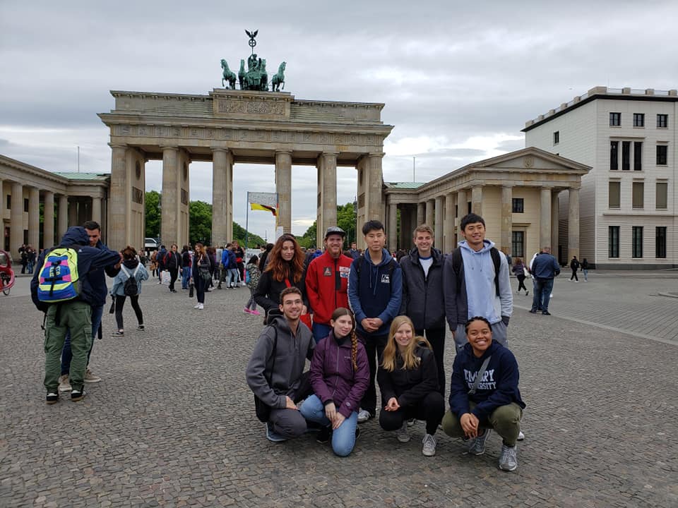 Oxford students posing for a picture in front of the Brandenburg Gate in Berlin
